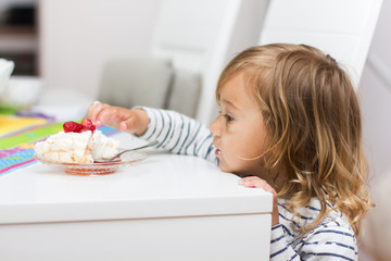 little girl eating dessert