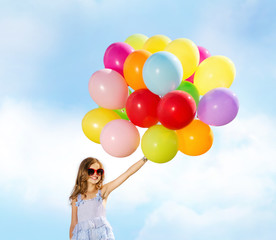 happy girl with colorful balloons