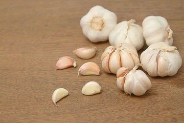 Fresh garlic on wooden background