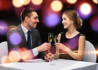 couple with glasses of champagne at restaurant