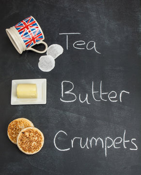 tea butter and crumpets on a blackboard