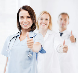 Fototapeta premium team of doctors showing thumbs up