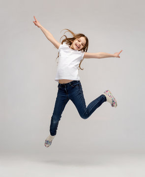 Smiling Little Girl Jumping