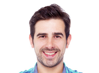 Obraz premium Portrait of a casual latin man smiling, isolated over a white ba