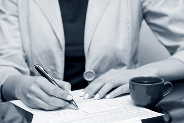 Business woman signing contract