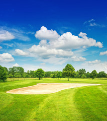 golf course and beautiful blue sky. green field