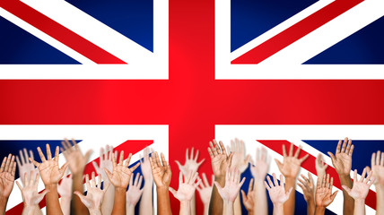 Group Of Multi-Ethnic Arms Outstretched With British Flag
