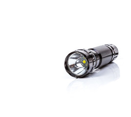 Black LED  flashlight isolated white background