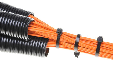 Corrugated pipe with cables isolated on white background 
