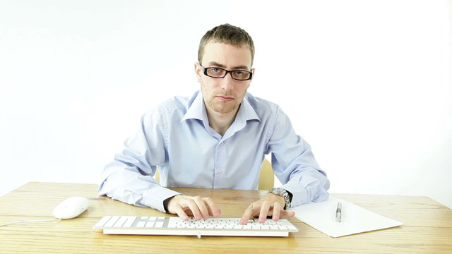 Angry frustrated business man working computer isolated white