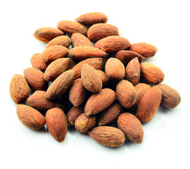 tasty almonds nuts, isolated on white