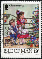 stamp shows Children decorating Christmas tree