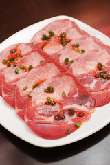 beef tongue sliced on white dish