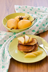 pear stewed in citrus juice and pancakes