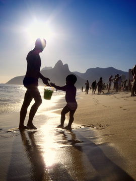 Silhouettes of Brazilian Father and Child Ipanema Beach Sunset