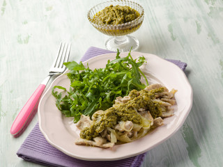 stewed meat with pesto sauce and arugula salad
