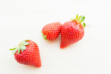 strawberry fruits on wooden table