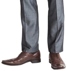 Businessmans feet in brown brogues