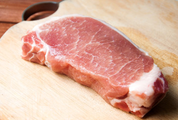 Raw pork on wood cutting board