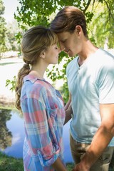 Obraz premium Close young couple standing together in the park