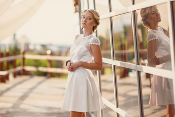 a young woman in summer dress in the Park on a sunny day.