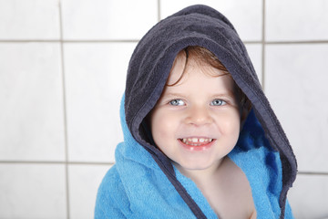 Portrait of lovely little toddler boy of two years  with bath to