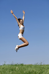 Fitness woman exercising in summer park