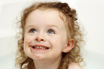 Funny dirty toddler in the bath