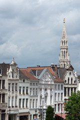 Houses on Albertine square with town hall tower