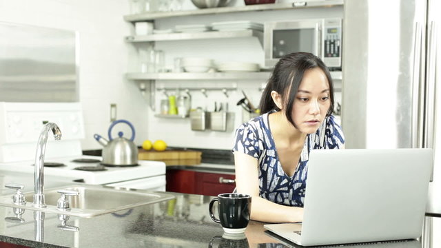 Asian girl in her kitchen