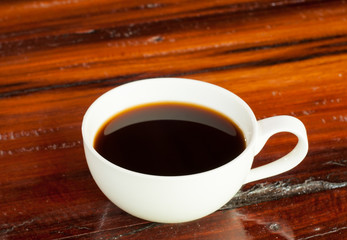 Black coffe on wood background