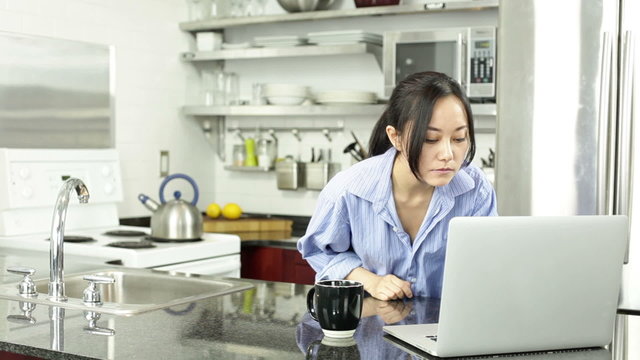 Asian girl in her kitchen