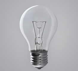 Light bulb lamp on grey background