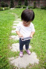 child using a digital tablet or smart phone