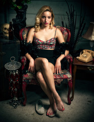 Beautiful Young Blond Woman Sitting in Chair