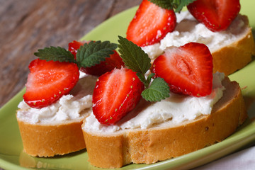 strawberries sandwiches with cream cheese and mint closeup