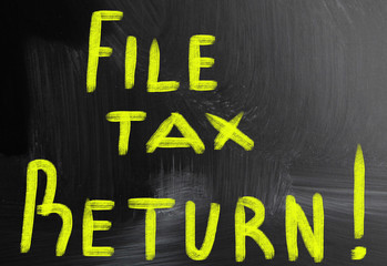 file tax return handwritten with chalk on a blackboard