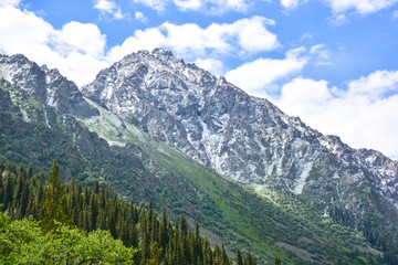 Obraz premium Clouds over the high mountains