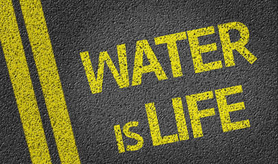 Water is Life written on the road