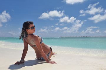Fototapeta na wymiar beautiful young woman on beach have fun and relax