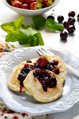 Pancakes with berry topping with fresh berries