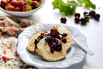 Pancakes with berry topping with fresh berries