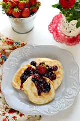 Pancakes with berry topping with fresh berries