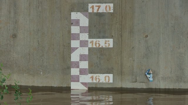 Water level marker on the pillar of a bridge showing critical rise in water level of river ( close up)