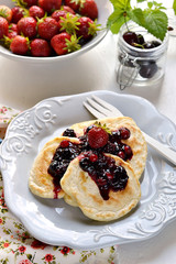 Pancakes with berry topping with fresh berries