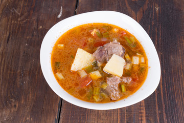 Goulash soup in a yellow bowl
