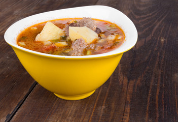 Goulash soup in a yellow bowl