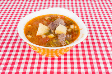 Goulash soup in a yellow bowl