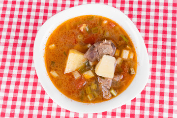Goulash soup in a yellow bowl