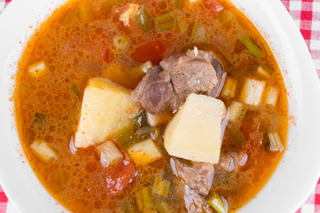 Goulash soup in a yellow bowl